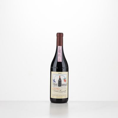 a bottle of red wine sitting on top of a table