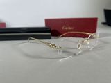 a pair of glasses sitting on a table next to a pair of glasses