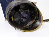 a helmet that is sitting on top of a suitcase