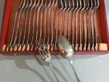 silverware in a red box with spoons and spoons in it