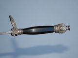 a silver and black sword with a black handle