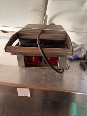 a machine that is sitting on a table in a kitchen