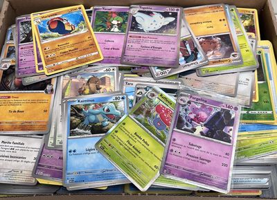 a box full of pokemon cards sitting on top of a table