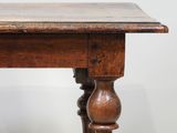 a small table with a wooden top on a white background
