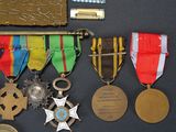 many medals and medals on display on a black surface
