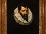 portrait of a bearded man in a black dress with a ruffled collar