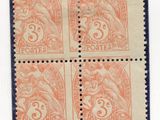 an orange and black stamp with four different images on it
