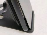 a close up of a cell phone on a stand