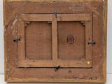 an old wooden picture frame with a picture of a man on it