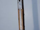 a knife that is sitting on top of a pole