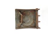 an old metal belt buckle with a horse on it