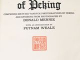 an old book with a red and black design on the cover
