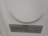 an image of a close up of the back of a white toilet