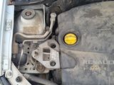 the engine of a car with its hood open and a yellow light on
