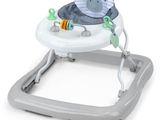 a close up of a baby ' s walker with a toy on top of it