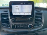 the dashboard of a car with a gps device in the center