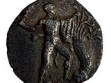 une image d'une pièce de monnaie sur laquelle figure un cheval, allongé sur le dos