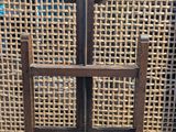 a close up of a wooden chair with a metal handle
