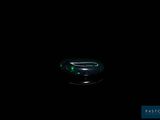 dark photo of a computer mouse sitting on top of a black surface