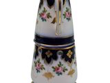 a white and black coffee pot with flowers on it