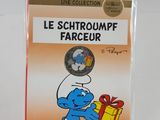 the smurch is holding a present in a clear box