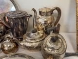a lot of silver items that are on a table