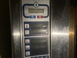 an image of a coin machine in a public place