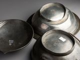 three metal bowls sitting on top of each other