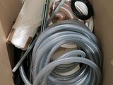 a box with a bunch of hoses in it