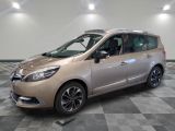 a picture of a beige car parked in a garage