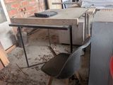 an image of a room with a table and chairs in it