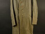 an old coat with a collar and buttons on a mannequin dummy