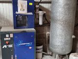 a tank and a water heater in a room