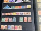 a lot of stamps on the pages of a book