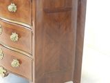 a marble top chest of drawers on a white background