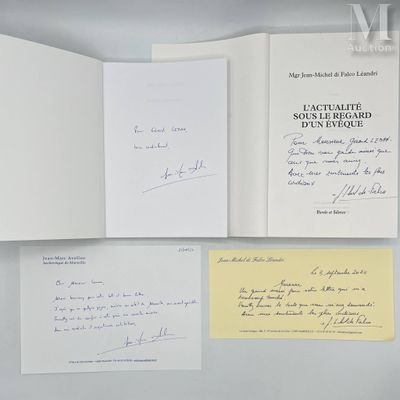 two open books with handwritten letters on them sitting on top of a table