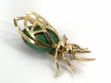 yellow gold plated insect brooch with green glass eyes
