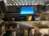 an image of a kitchen with a lot of stuff in it
