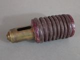 a close up of a small metal object on a table