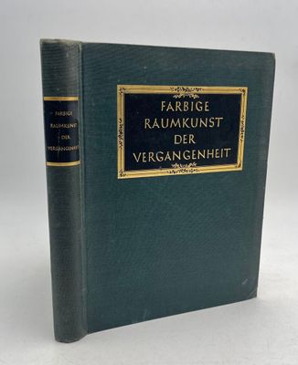 un livre vert avec des bordures dorées et une couverture noire