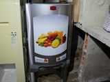 a refrigerator that has a bunch of fruit in it