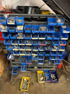 many different types of screws and nuts in the garage