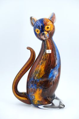 a colorful cat figurine sitting on a white surface