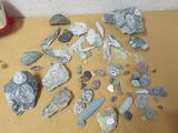 a pile of rocks on a table next to a pair of scissors and a pair of scissors