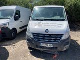 two white vans parked next to each other in a parking lot