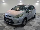 a picture of a silver ford fiesta parked in a showroom