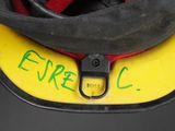 a close up of a helmet with a tag attached to it