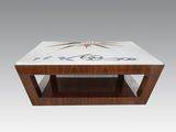 a coffee table with a glass top and a wooden base