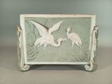 two birds that are standing on a table