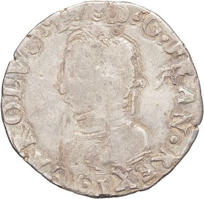 a silver coin with an image of a man on it